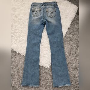 Vigoss Marley Boot Cut Mid Rise Jeans. Size 27. V stitch embroidered pockers.
